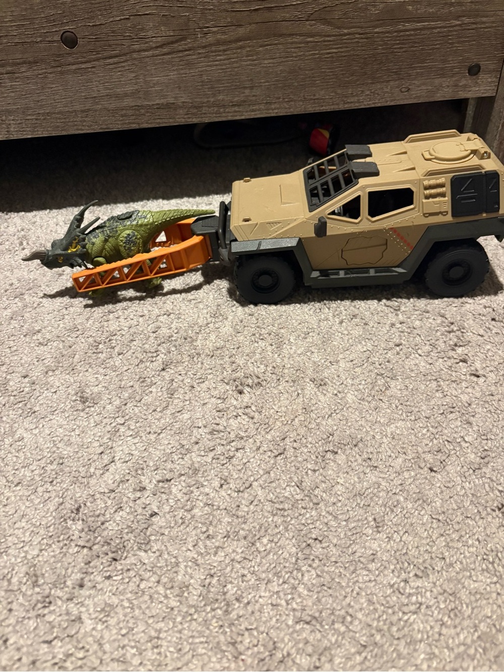 Desert Tan Tactical Rescue Truck with Orange Ramp and Green Dinosaur
